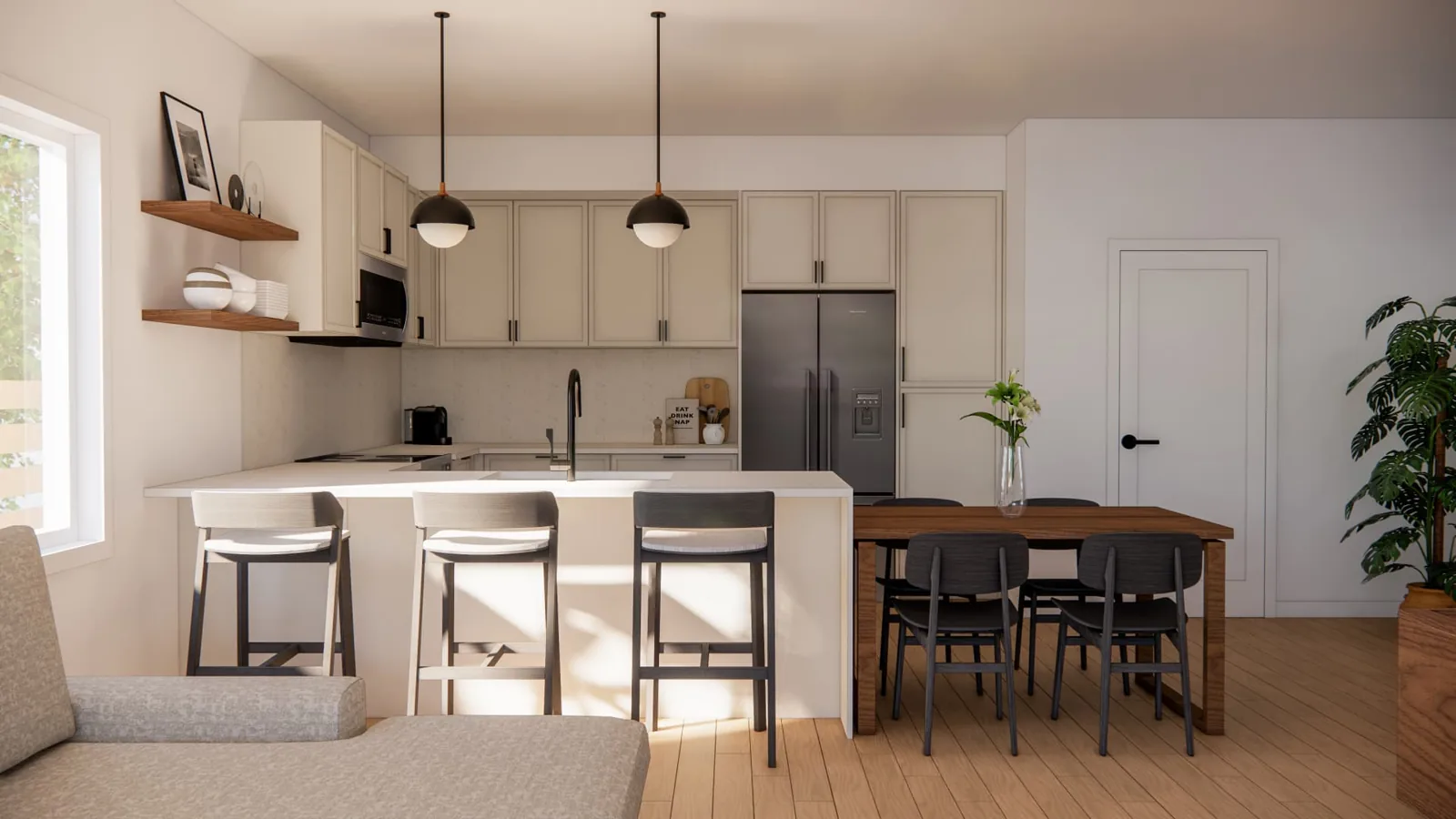 Vanhorne kitchen and dining interior, Penticton BC: cream shaker cabinetry, black pendant lights, quartz island seating, and a walnut dining table